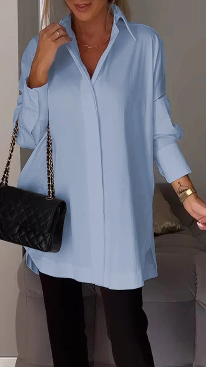 Elegante oversized blouse met opgerolde mouwen