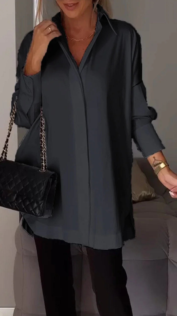 Elegante oversized blouse met opgerolde mouwen