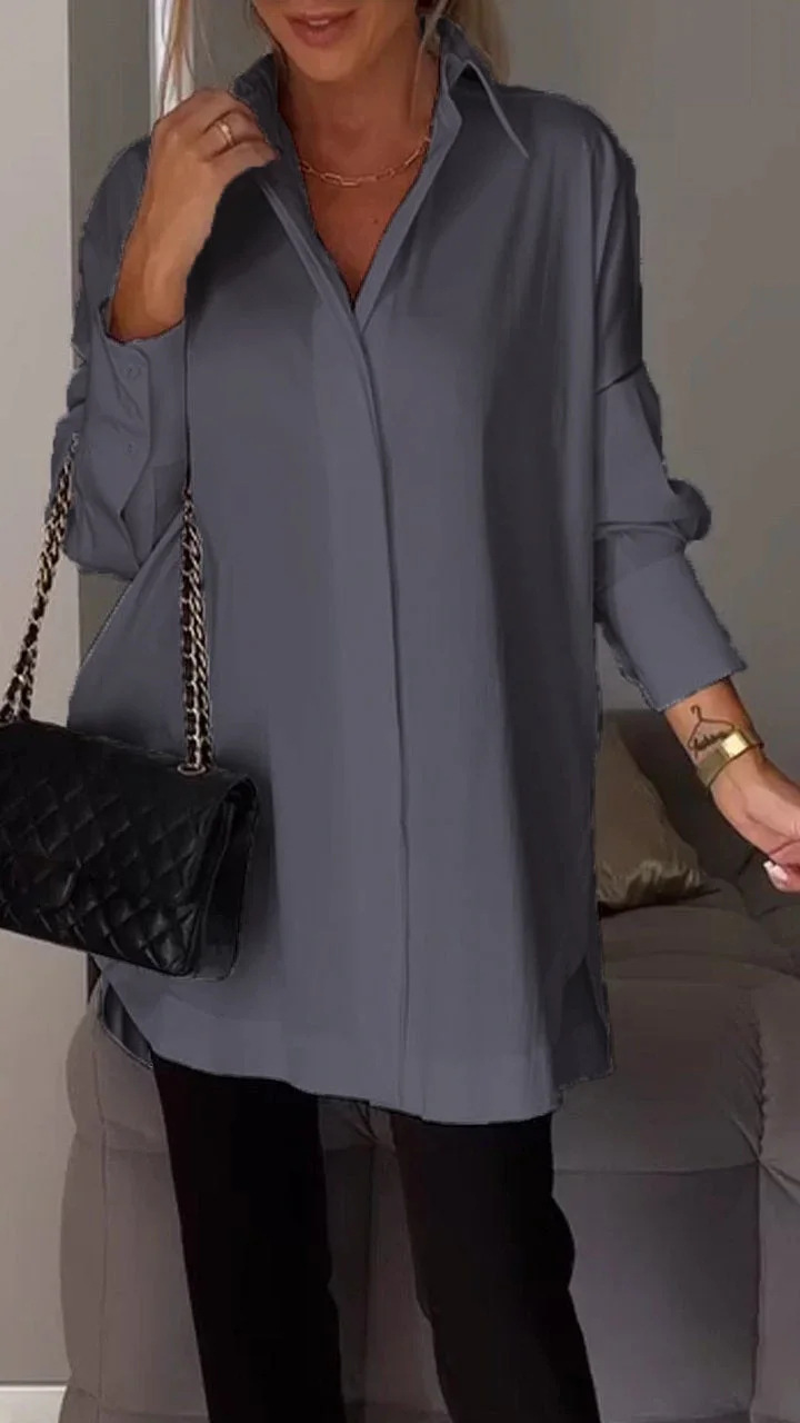 Elegante oversized blouse met opgerolde mouwen