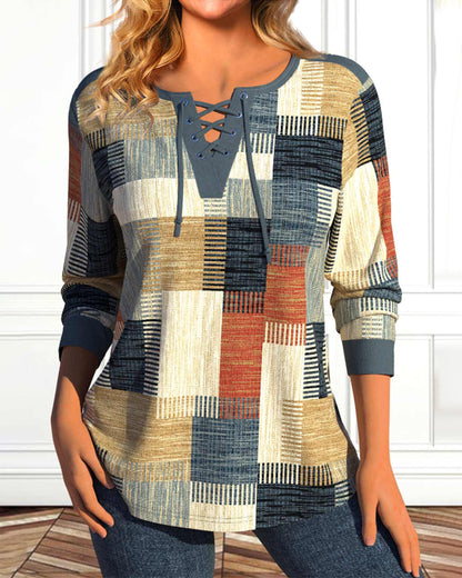 Top met vetersluiting en geometrische print