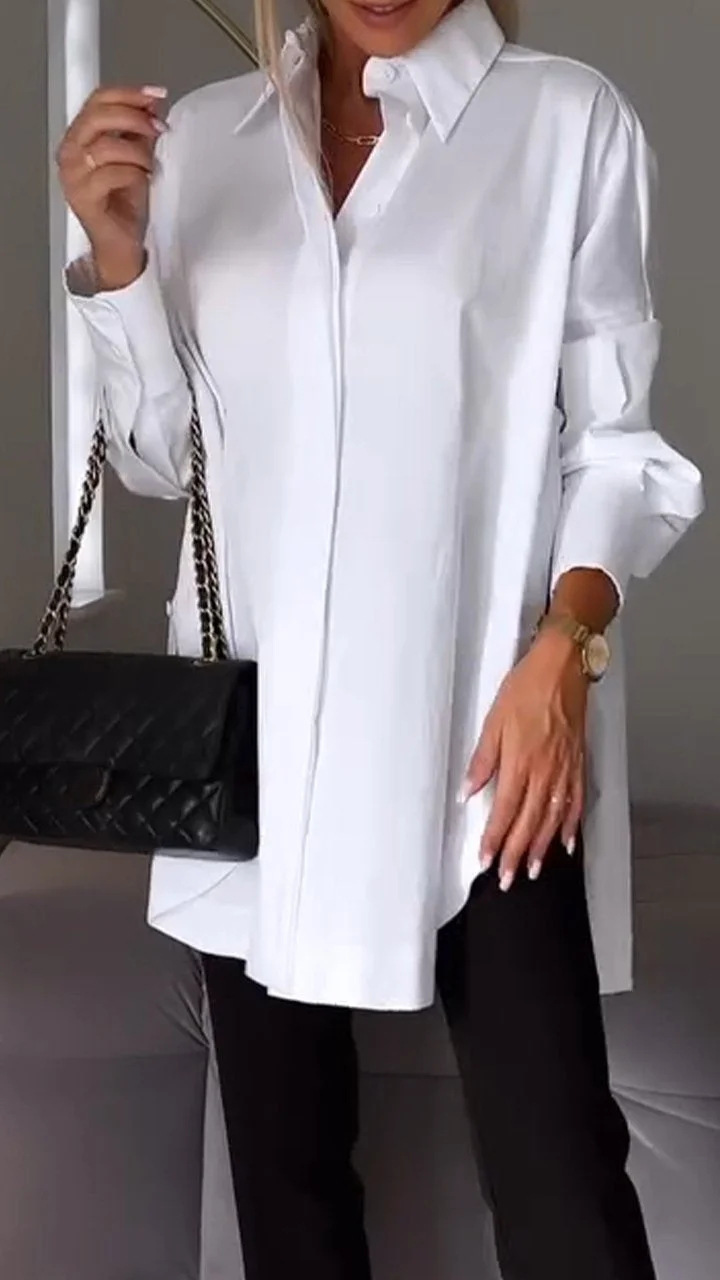 Elegante oversized blouse met opgerolde mouwen