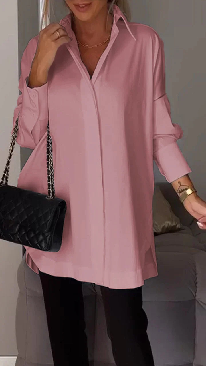 Elegante oversized blouse met opgerolde mouwen