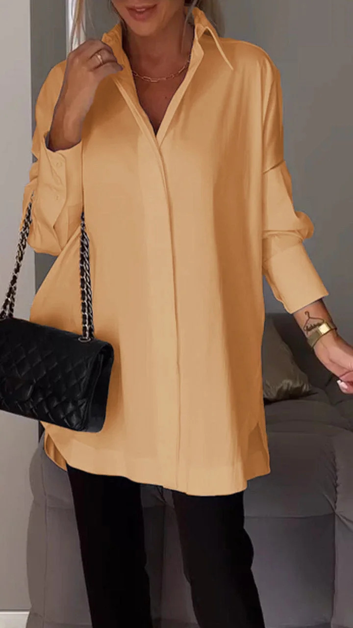 Elegante oversized blouse met opgerolde mouwen