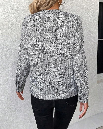 Bedrukte, elegante blouse met lange mouwen en V-halslijn